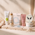 The Full Glass-Skin Ritual — five products on travertine