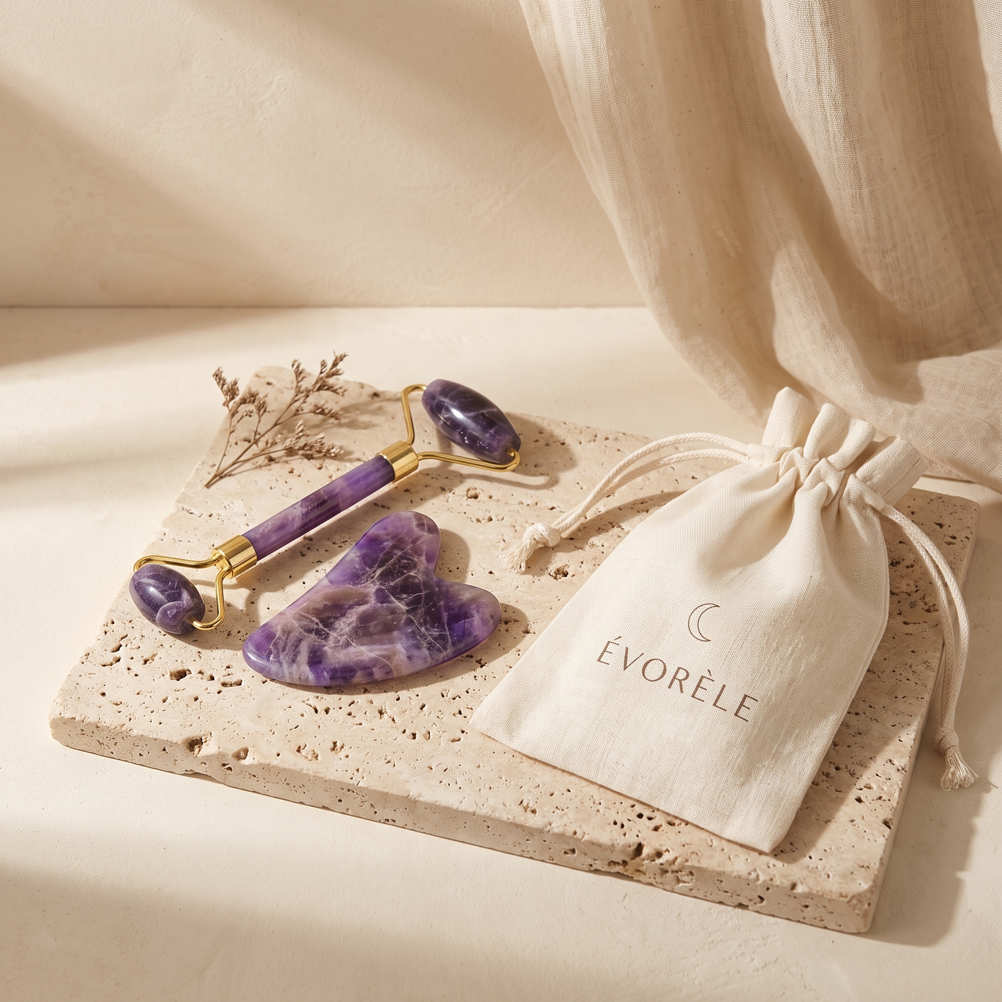 Évorèle Amethyst Roller & Gua Sha Set — amethyst heart gua sha, gold-frame roller and linen pouch