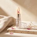 Évorèle Dried-Flower Jelly Lip Balm — transparent crystal case, clear jelly bullet with real dried flower